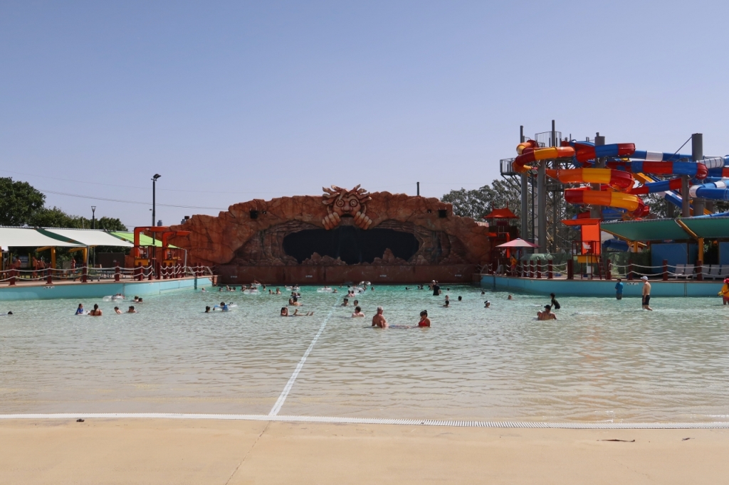 People taking a dip in the Cave of Waves at WhiteWater World Theme Park
