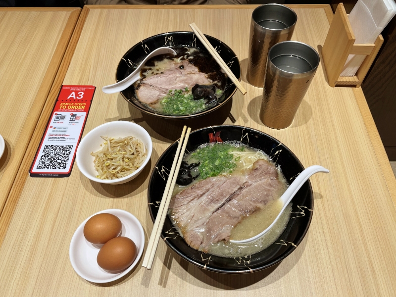 Tonkotsu ramen and black spicy tonkotsu ramen with side dishes of beansprouts and hard-boiled eggs from Ramen Dining Keisuke Tokyo restaurant